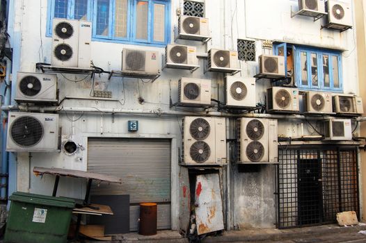 Air conditioning on the wall at side street, Singapore