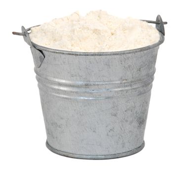 Plain / all purpose flour in a miniature metal bucket, isolated on a white background