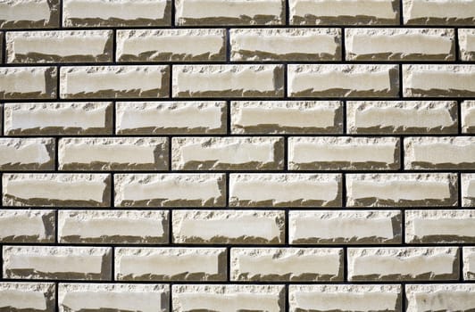 Wall from a white brick as a building or construction background