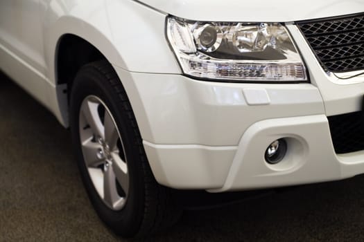 Headlights of the modern white car