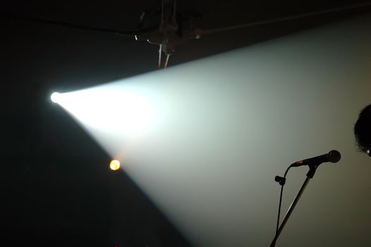 Spotlight beam of light through smoke