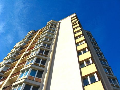 The multi-storey modern house on the blue sky background