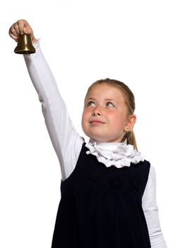 Young school girl ringing a golden bell on an outstretched arm on white background