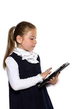 The little girl with the tablet on a white background