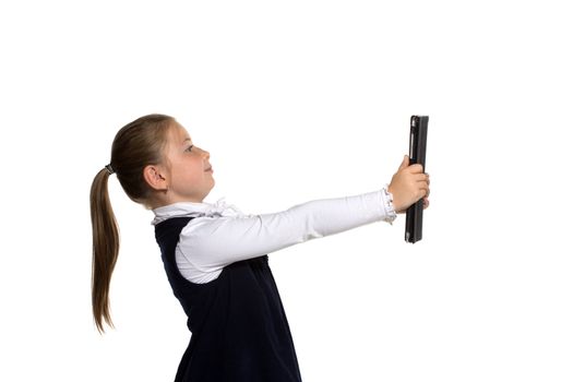 The little girl with the tablet on a white background