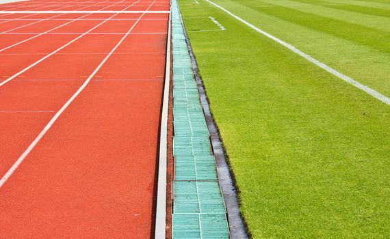 a running track and grass.