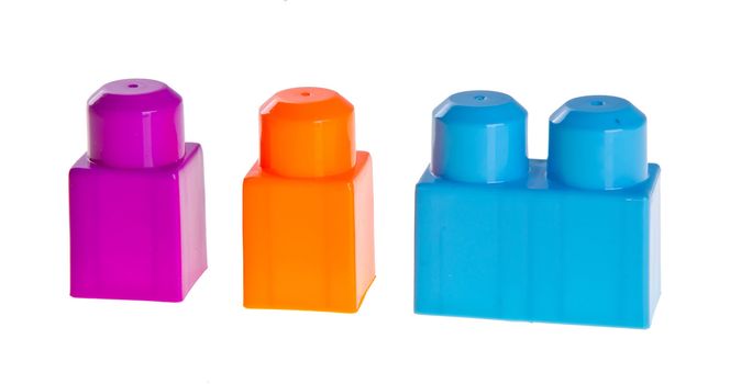 Plastic building blocks on a background