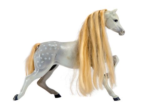White statue figure of horse with long blonde mane isolated on white background. Nice toy decor.