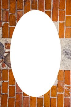 Isolated white oval place for text photograph image in center of frame. Fragment of ancient red brick wall with stones ant cement in it.