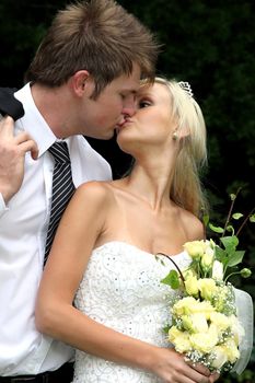 Lovely young couple sharing a kiss on their wedding day