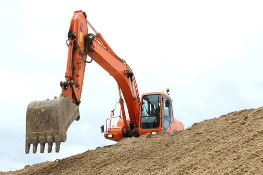 Digging machine excavation in a sandy pit