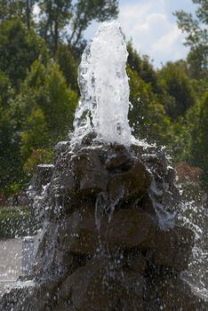 A beautiful fountain in a sun summer day