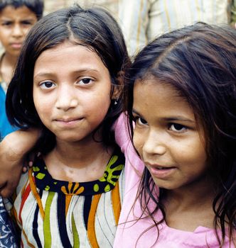 Indian little girls from slam in bright clothes