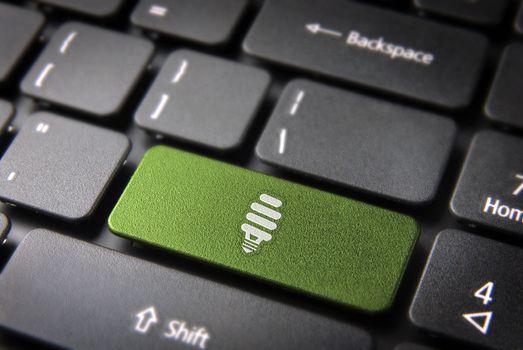 Green energy key with eco bulb light icon on laptop keyboard. Included clipping path, so you can easily edit it.