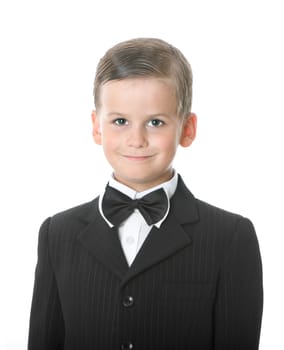 Boy in a suit smiles isolated on white background