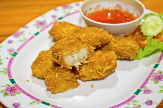 Nuggets, fried fish with sauce.