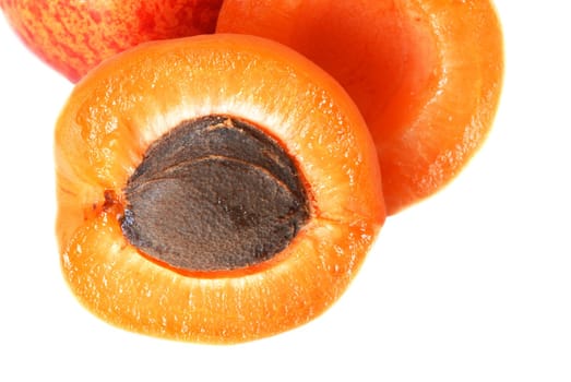 appetizing ripe orange apricot closeup macro over white background
