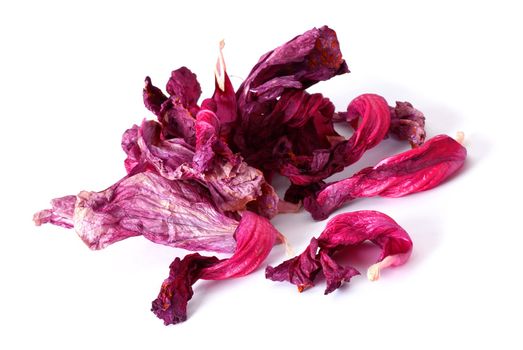 drying hibiscus tea petals over white background