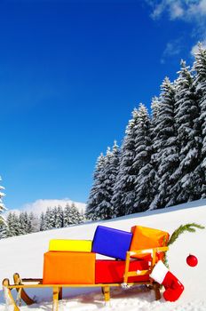 colorful presents on a Santa Claus sledge in a winter landscape