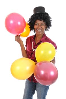 Lovely smiling and happy African woman with party baloons