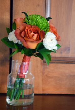 Floral bridal bouquet in glass vase