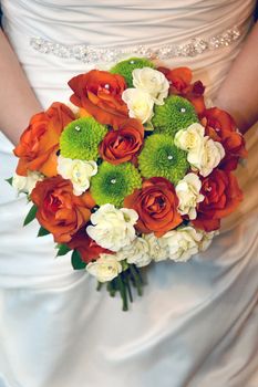 Bride holding colorful bouquet







Red, green and white bridal bouquet