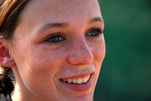young teenager with freckles on her face