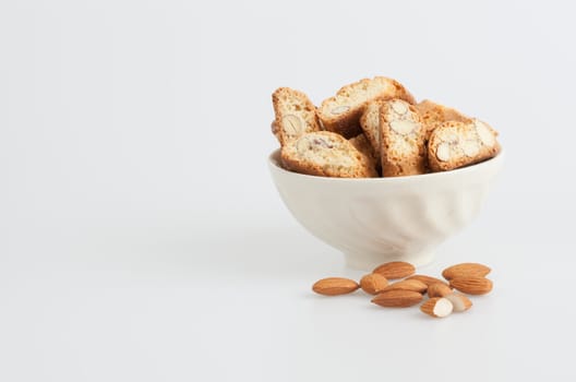 Almond biscotti bowl on a white background