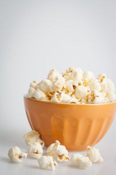 Orang popcorn bowl on a white background