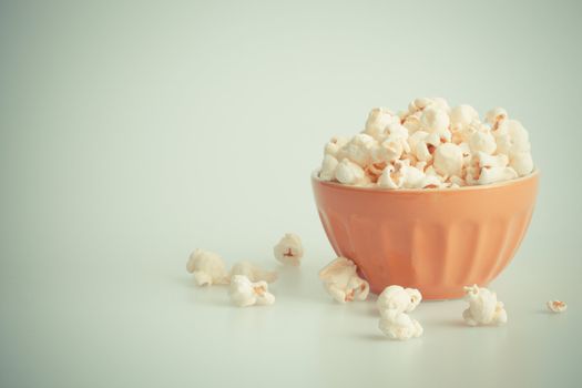 Orang popcorn bowl on a white background