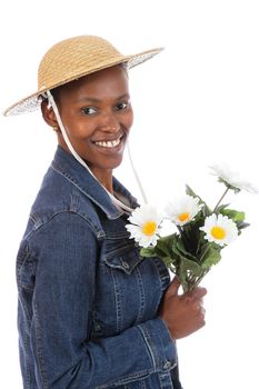Lovely smiling African woman holding a bunch of flowers