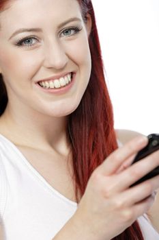 Happy smiling young woman reading texts and laughing.