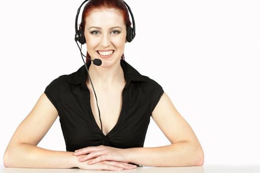 Professional woman talking on a headset in her office at work. With white background