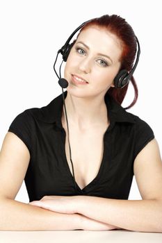 Professional woman talking on a headset in her office at work. With white background