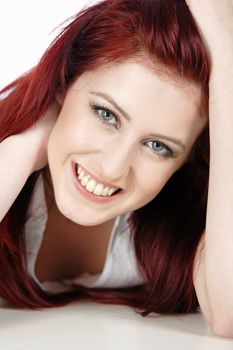 Sexy womans face with long red hair smiling