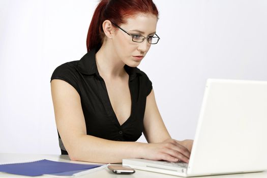 Professional woman showing concern at work using her laptop