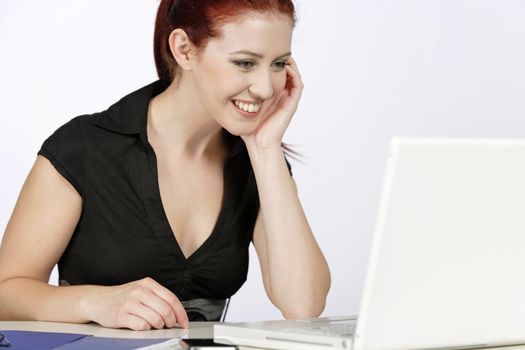 Young professional woman working at her desk