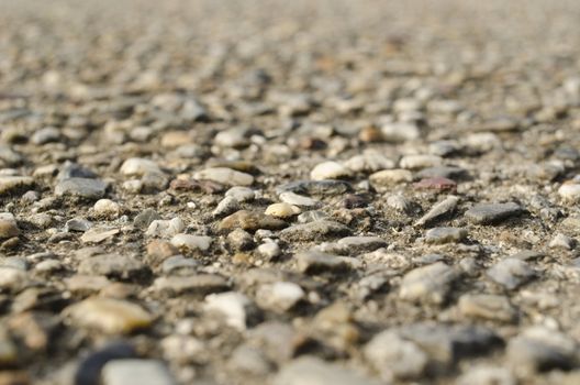 Detail macro view on the structure of a gravel path or street, background structure