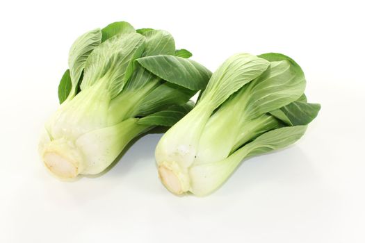 Asian white-green pak choi on a light background