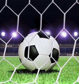 closeup soccer ball on green grass of stadium