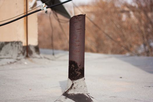 Rusty pipe on a roof