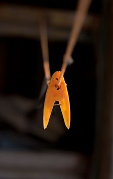 yellow clothes-peg on rope