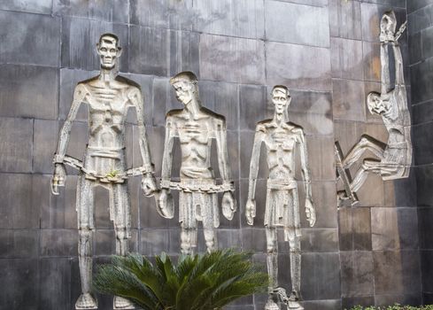 Vietnam Hanoi. four starved male bodies in chains.