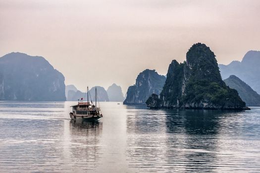 Vietnam Halong Bay. Romantic peaceful mysterious scenery out of fairytale.