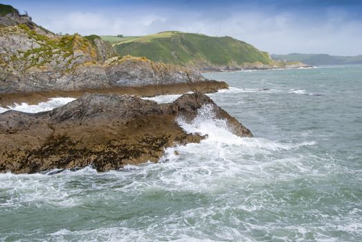 Waves Breaking on a rocky headland in Cornwall England