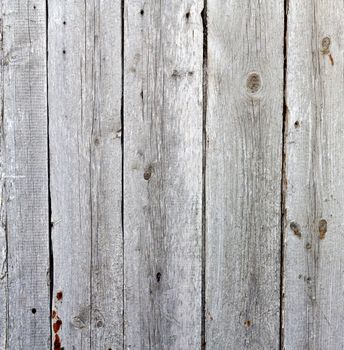 Close up of gray wooden fence panels 