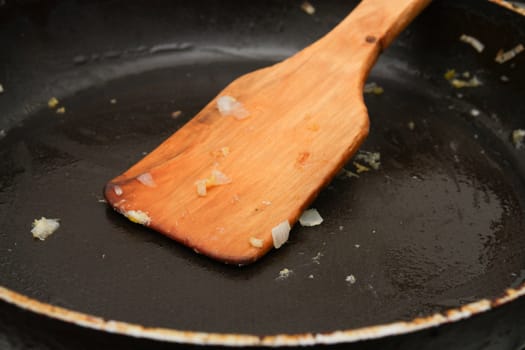 wooden spoon in the pan