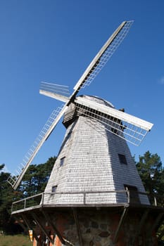 old traditional windmill against a blue sky