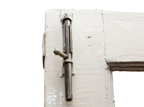 A keyhole on a gray door. 