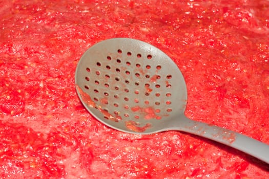 tomato sauce with a spoon